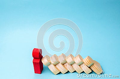 Leader businessman stops falling dominoes. Strong and reliable boss. Difficulties in business and their solution. Support team. Stock Photo