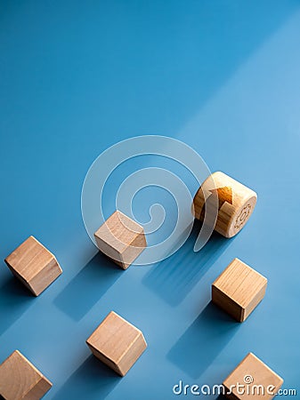 Leadership, business success, unique, difference, challenge, motivation concepts. Arrow on wooden cylinder block rolling fastest,. Stock Photo