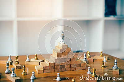 Leadership concept with king chess on top wooden block. Stock Photo