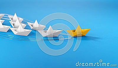 Leadership concept, yellow leader boat leading whites Stock Photo