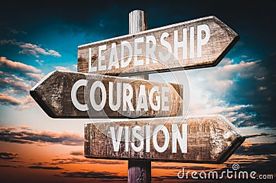 Leadership, courage, vision - wooden signpost, roadsign with three arrows Stock Photo