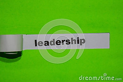 Leadership, inspiration concept on green torn paper Stock Photo