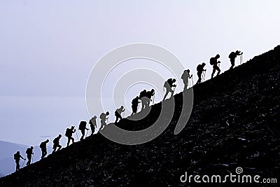 Leading pioneer man guiding the mountaineering team to the event and spectacular mountaineering programs Stock Photo