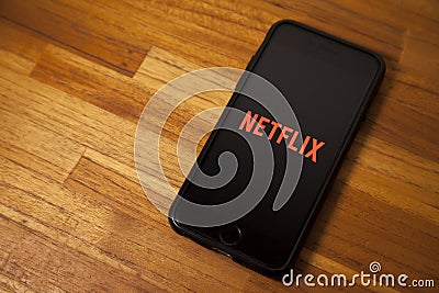Leading platform in the movie streaming segment, netflix with the application open on a cell phone. Editorial Stock Photo