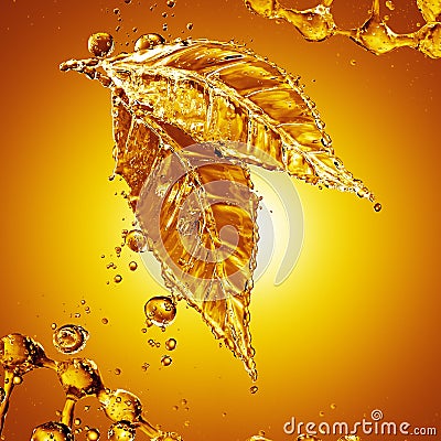 Leaf made of oil splash on gold background Stock Photo