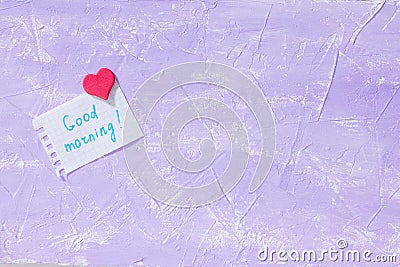 Leaf Notebook inscription good morning on purple table top. The cozy breakfast or Mother`s Day. Stock Photo