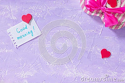 Leaf Notebook inscription good morning on purple table top. The cozy breakfast or Mother`s Day. Stock Photo