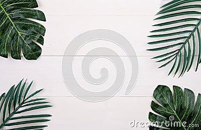 Leaf on wooden table, composition with top view, branch and leaves on wood desk with copy space. Stock Photo