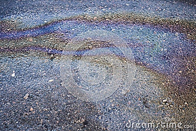 Leakage of oil or gasoline from under the car on the asphalt in the parking lot Stock Photo