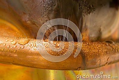 Leaking copper pipe Stock Photo