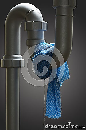 Leaking pipe with towel Stock Photo