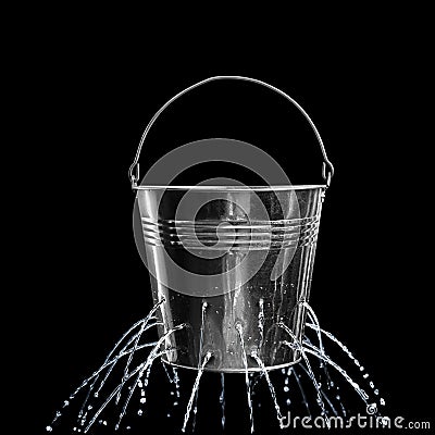 Leaky bucket with water on background Stock Photo