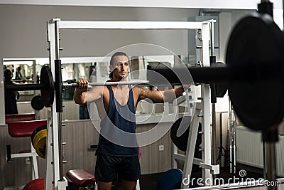 Leaning On Barbell Stock Photo