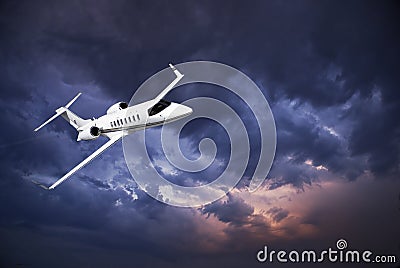 Learjet 45 with Storm Clouds Stock Photo