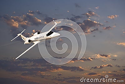 Learjet 45 with Sunset Clouds Stock Photo