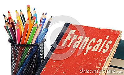 Learn French, textbook and pencils isolated Stock Photo