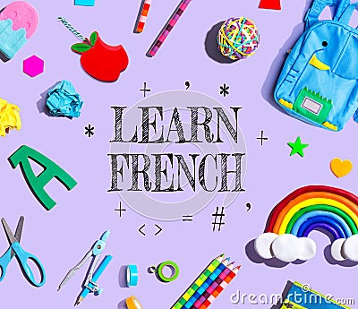 Learn French theme with school supplies on a purple background Stock Photo