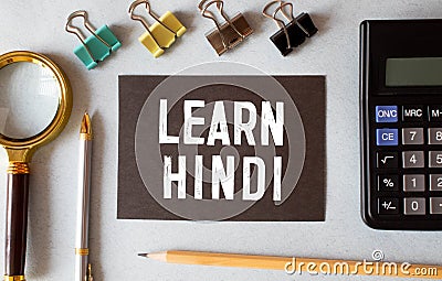 learn Hindi language sign on black background Stock Photo