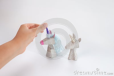 Learn how to make unicorn from recycled paper. Eco-friendly craft tutorial, kids& x27; DIY project. Transform paper waste Stock Photo