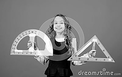 Learn mathematics. Theorems and axioms. Smart and clever concept. Sizing and measuring. Girl with big ruler. School Stock Photo