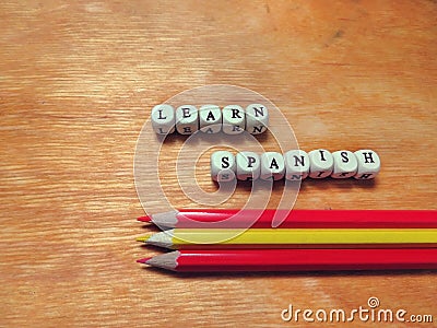 Learn Spanish and colored pencils Stock Photo