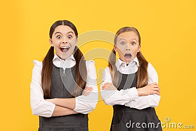 Learn with surprise. Surprised children keep arms crossed. Primary schooling. Formal schooling Stock Photo