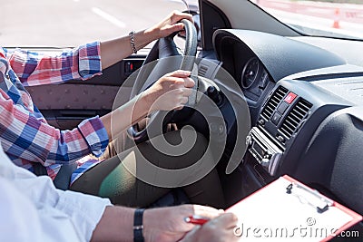 Learner driver student driving car with instructor Stock Photo