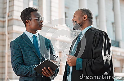 Learning from the best. two male lawyers talking in the city. Stock Photo