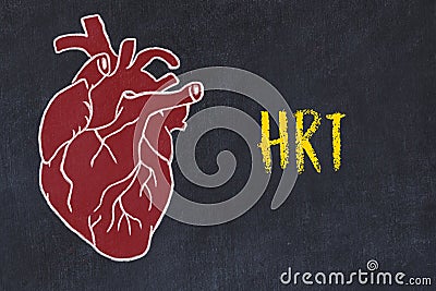 Learning cardio system concept. Chalk drawing of human heart and inscription HRT Stock Photo