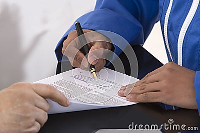 Learning contract signature Stock Photo