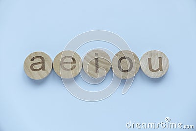 Learning english concept.Vowels of AEIOU on a blue background Stock Photo