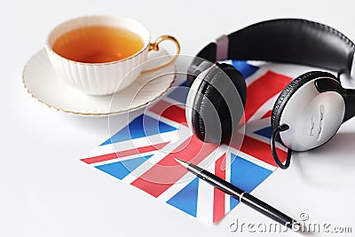 Learning foreign languages. Notepad for entries and a flag. Lang Stock Photo