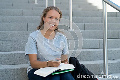 Learning german female student preparing for graduation Stock Photo