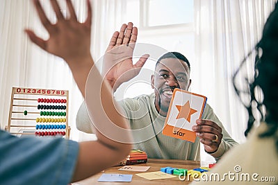 Learning, high five and father with children for homework, school activity and learning shapes at home. Black family Stock Photo