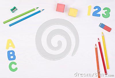 Learning how to read, write and count. Kid`s desk with colorful letters, numbers and pencils Stock Photo