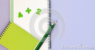 Learning maths. Kid`s desk with blank notebook, colorful pencils and numbers top view with copy space Stock Photo