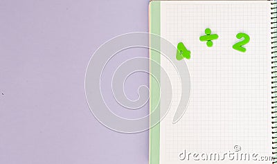 Learning maths. Kid`s desk with blank notebook and numbers top view with copy space Stock Photo