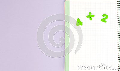 Learning maths. Kid`s desk with blank notebook and numbers top view with copy space Stock Photo