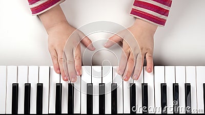 learning a musical instrument,child hand on piano keys Stock Photo