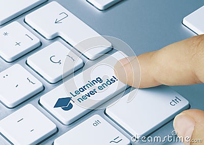 Learning never ends! - Inscription on Blue Keyboard Key Stock Photo