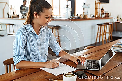 Learning, Studying. Woman Using Laptop Computer At Cafe, Working Stock Photo