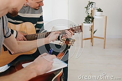 Learning to play the guitar. Stock Photo