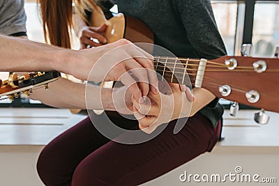 Learning to play the guitar. Music education and extracurricular lessons Stock Photo