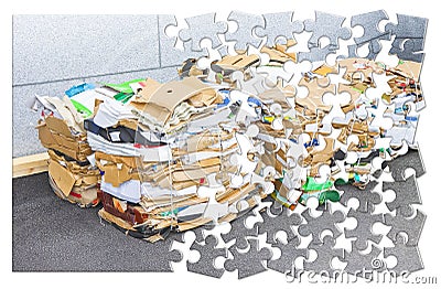 Learning to recycle - concept image in jigsaw puzzle shape - Stacks of paper and cardboard ready to be recycled Stock Photo