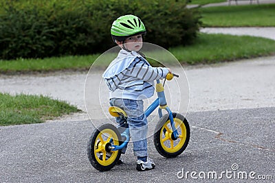 Learning to ride on a first bike Stock Photo