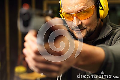 Learning to shoot a gun. Stock Photo