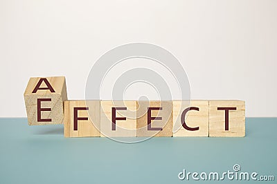 Learning to use proper grammar, Flipping one wooden cube to change the word Affect to Effect Stock Photo