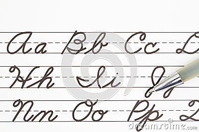 Learning to write cursive lettering Stock Photo