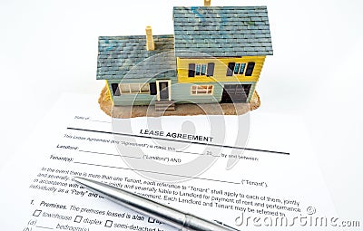 Lease agreement contract form with yellow model house Stock Photo