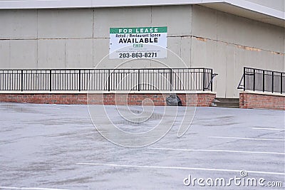 For Lease sign on boarded up business building Editorial Stock Photo